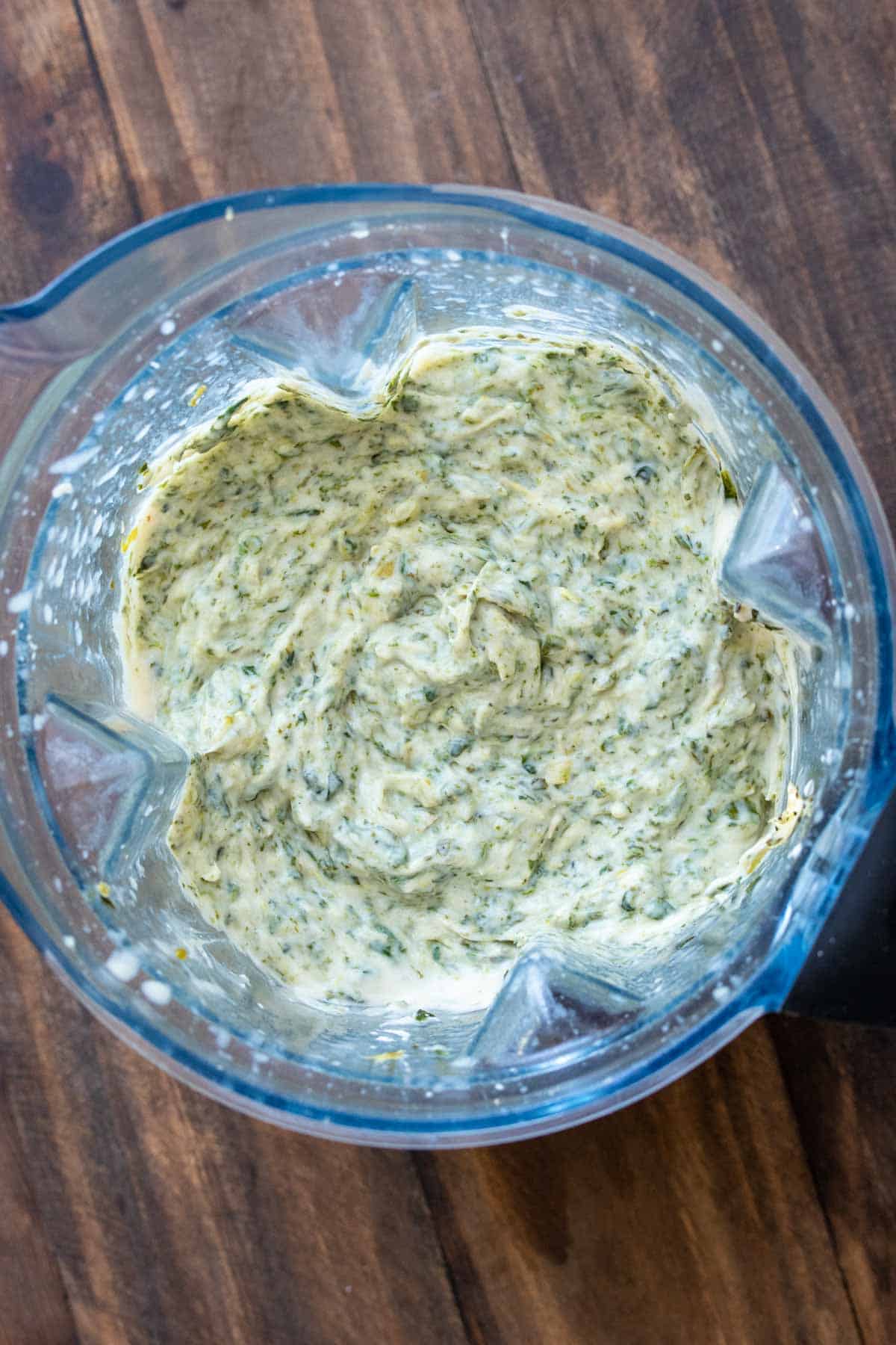 Top view of spinach artichoke dip in a blender