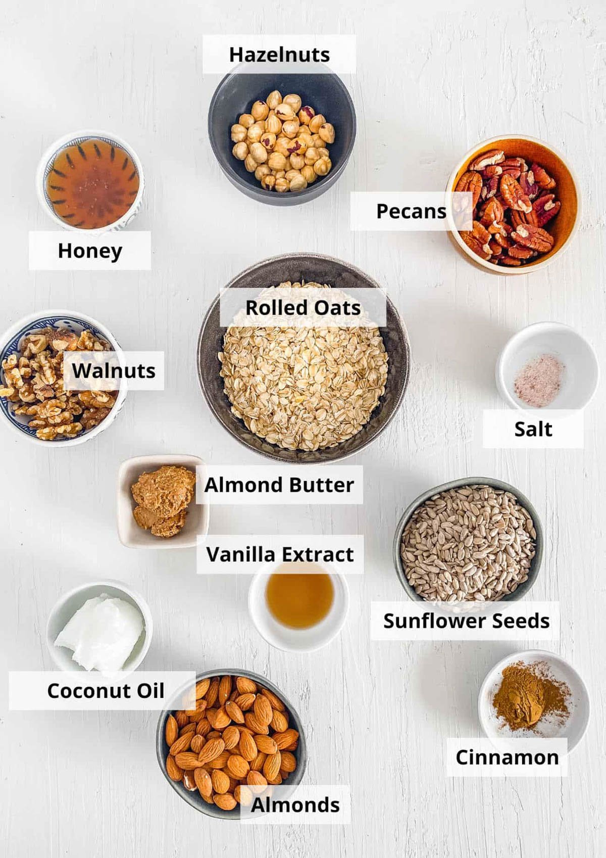 Ingredients for high protein granola recipe on a white background.