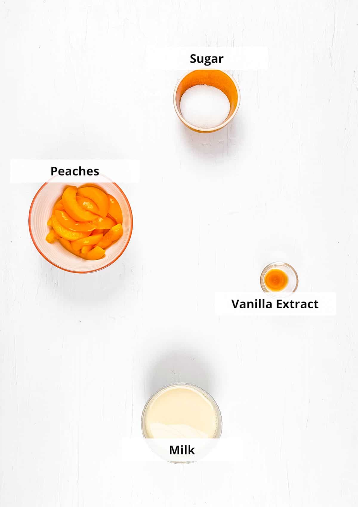 Ingredients for easy peach milk recipe on white background.