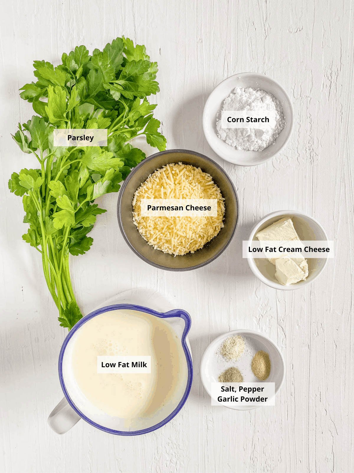 Ingredients for alfredo sauce without heavy cream on a white background.