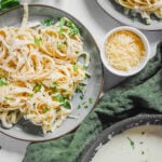 Alfredo sauce without heavy cream tossed with fettuccine on a plate.