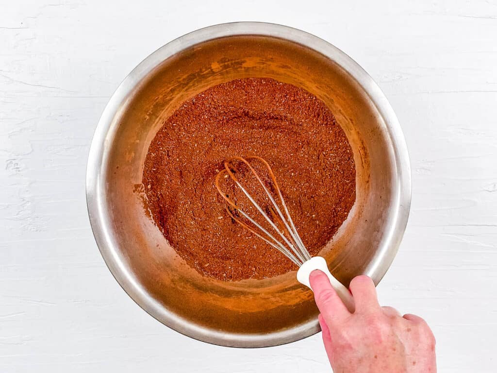 Dry ingredients for brownies to increase milk supply mixed in a mixing bowl.