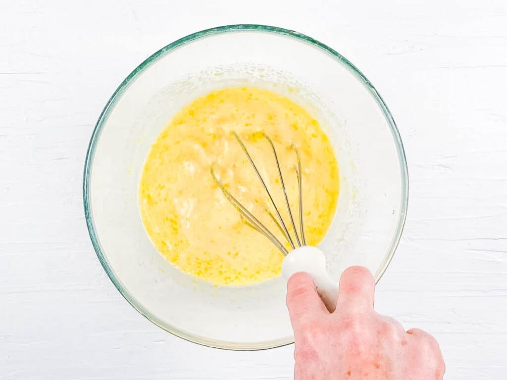 Wet ingredients for brownies in a mixing bowl.