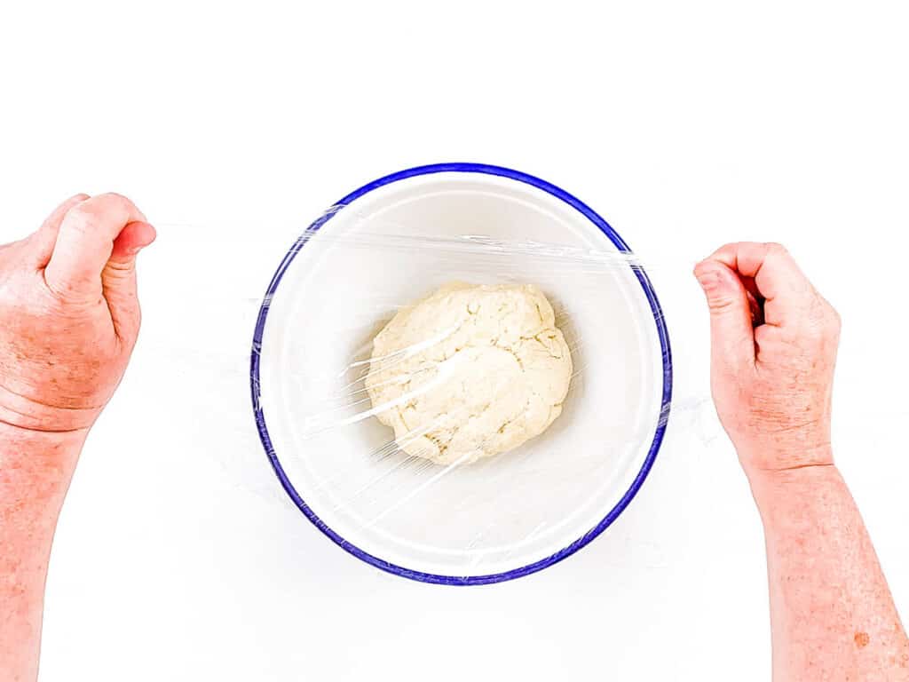 Sourdough discard croissant dough in a mixing bowl.