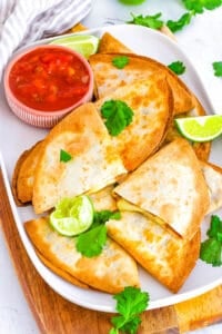 Healthy air fryer quesadilla recipe served on a white platter with salsa on the side.