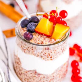 Healthy flaxseed pudding served in a glass jar topped with fresh fruit.