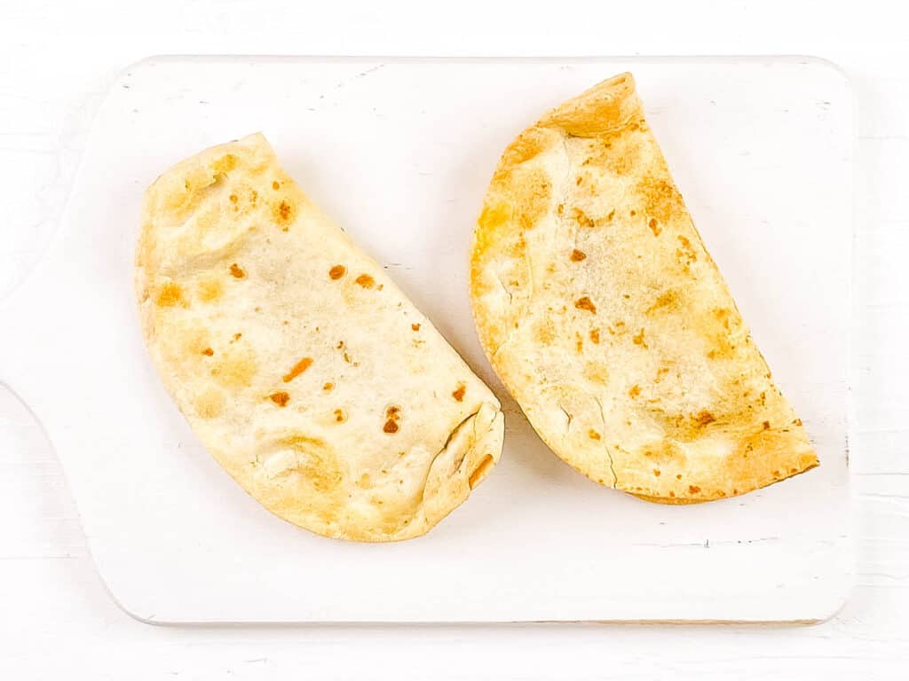 Healthy air fryer quesadillas on a white cutting board.
