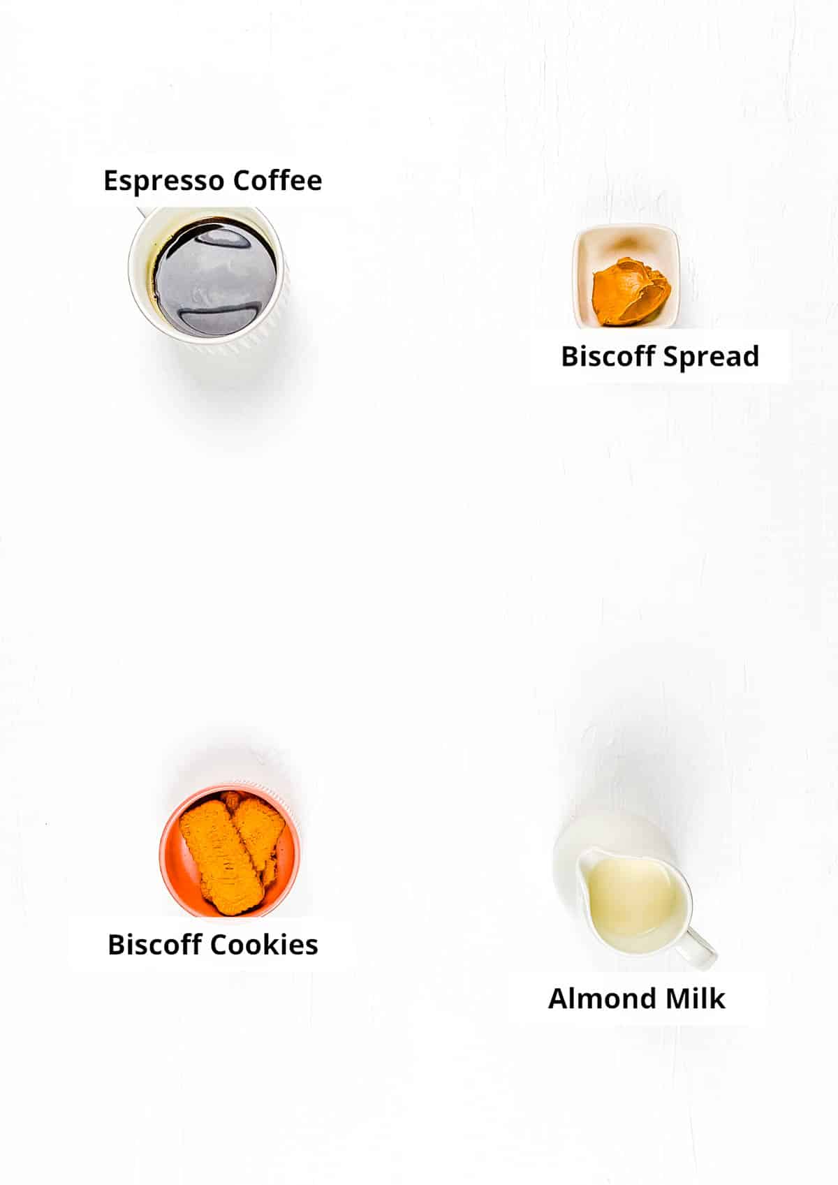 Ingredients for Biscoff latte recipe on a white background.
