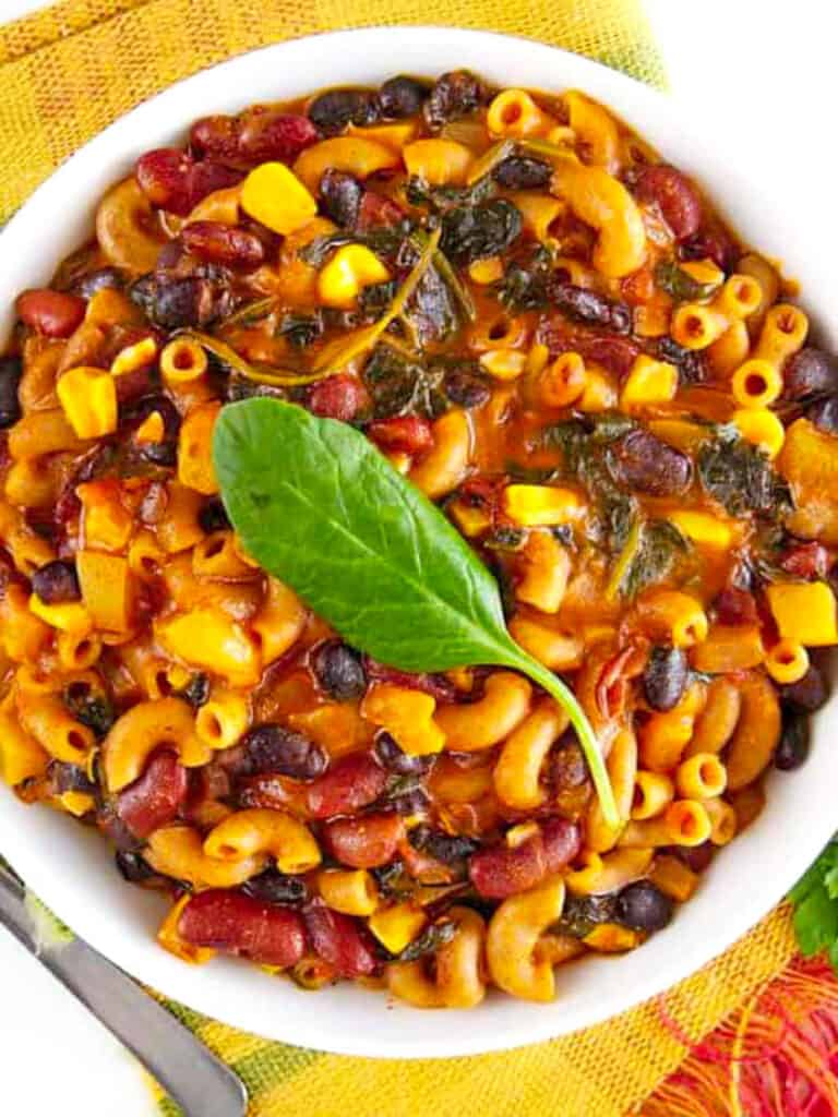 Instant Pot chili mac and cheese served in a white bowl.