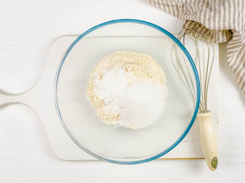 Dry ingredients for waffle batter in a mixing bowl.