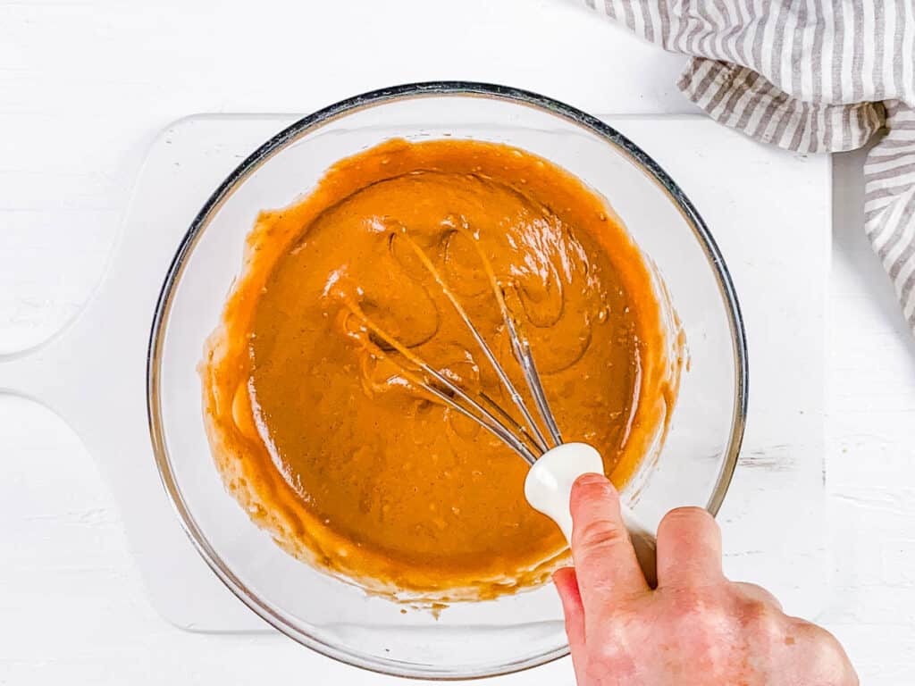 Chocolate hazelnut waffle batter in a mixing bowl.