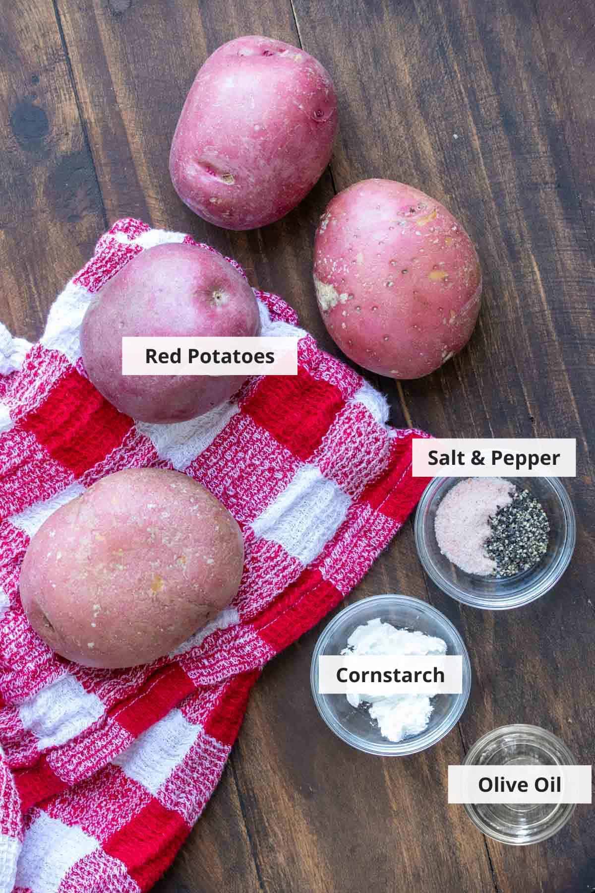 Ingredients for crispy french fries with cornstarch on a wood background.