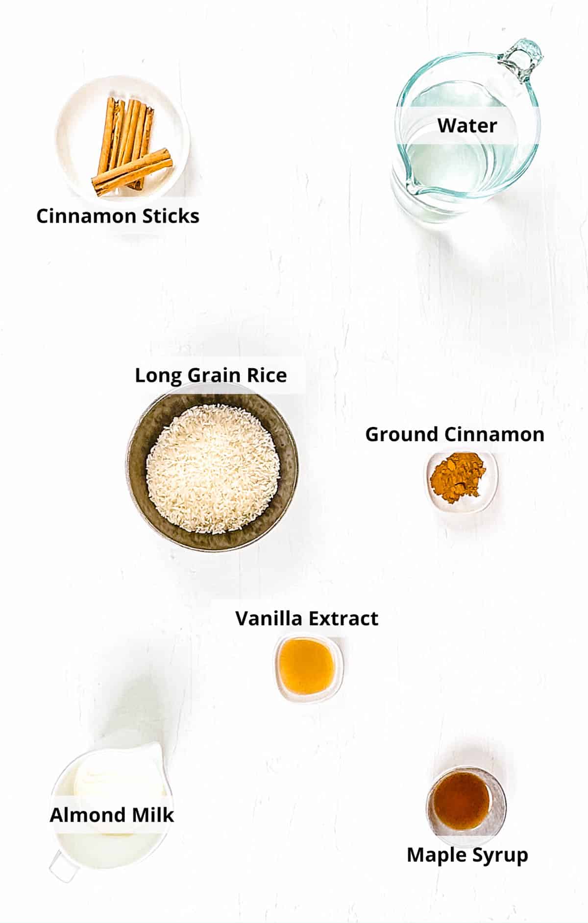 Ingredients for authentic vegan horchata recipe on a white background.