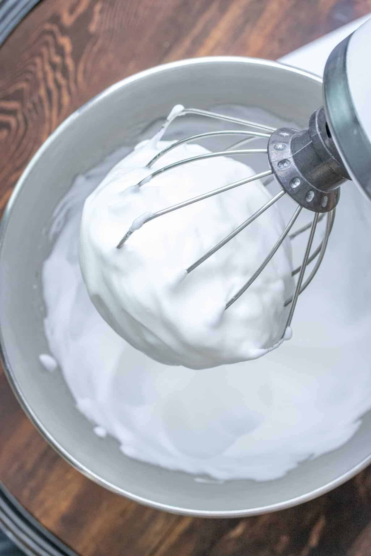 Stand mixer whipping up creamy frothy topping.