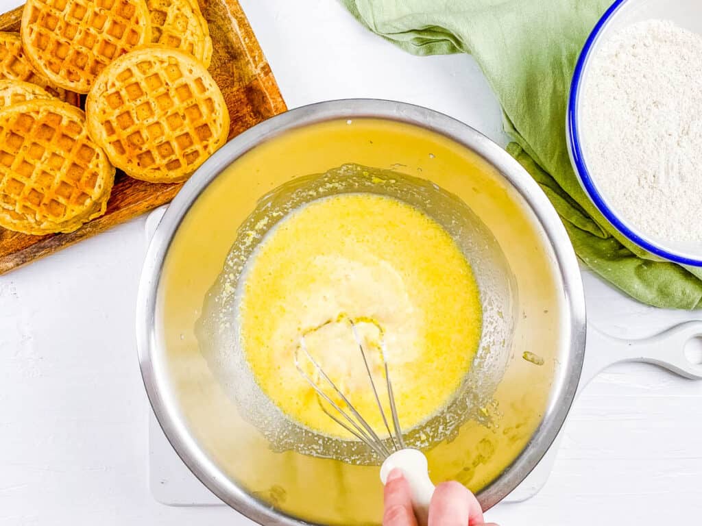 Egg free waffle batter being mixed in a mixing bowl.
