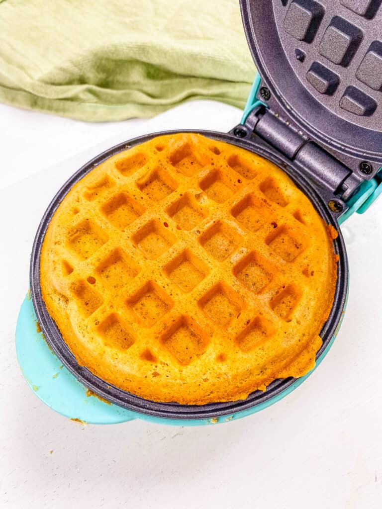 Healthy gluten free waffles cooked in a waffle iron, ready to be served.