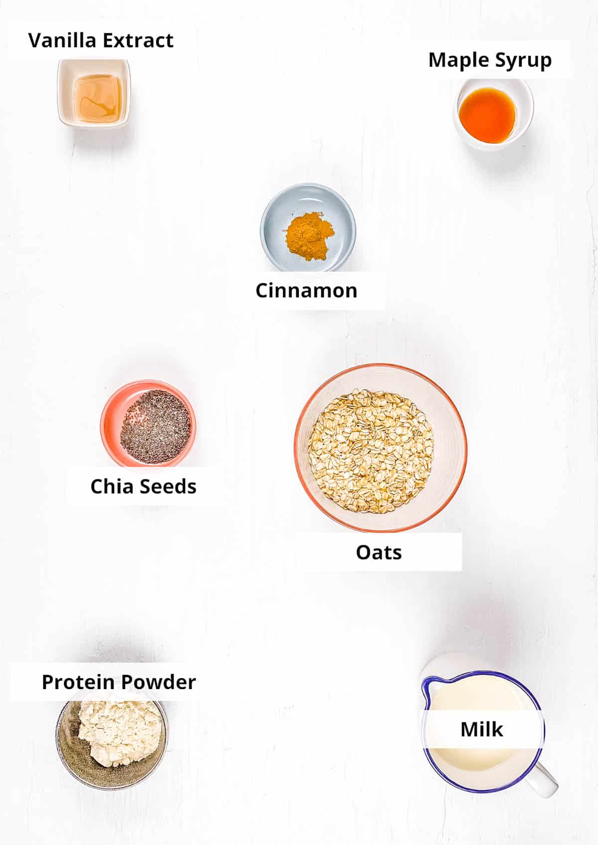 Ingredients for high protein overnight oats recipe on a white background.