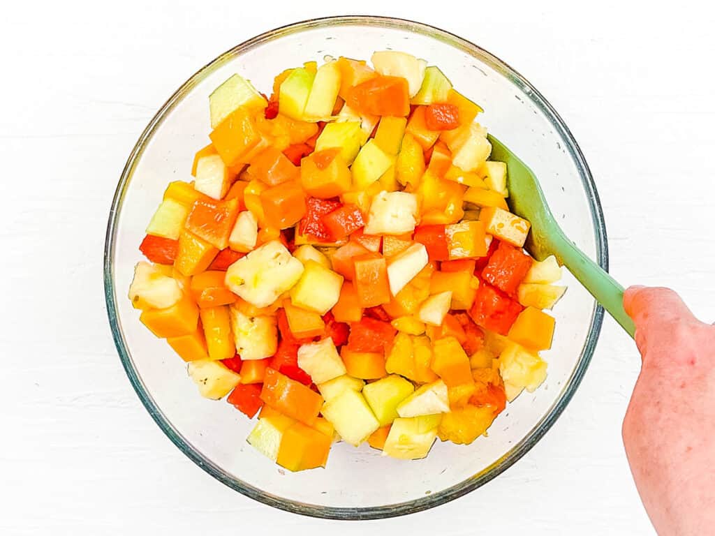 Melon, watermelon and cantaloupe tossed in a mixing bowl.