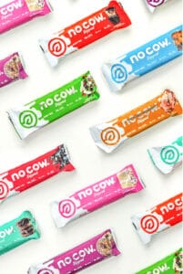 Assortment of no cow protein bars on a white background.