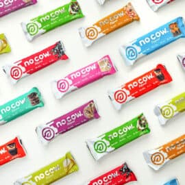 Assortment of no cow protein bars on a white background.