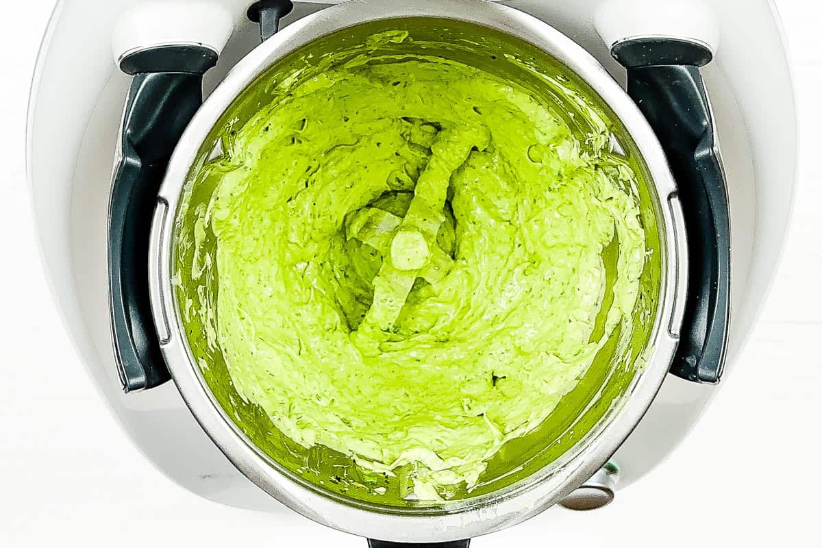 Creamy smooth avocado green goddess dressing in the blender. 