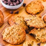Healthy, vegan, gluten free lactation cookies stacked on a wooden cutting board.