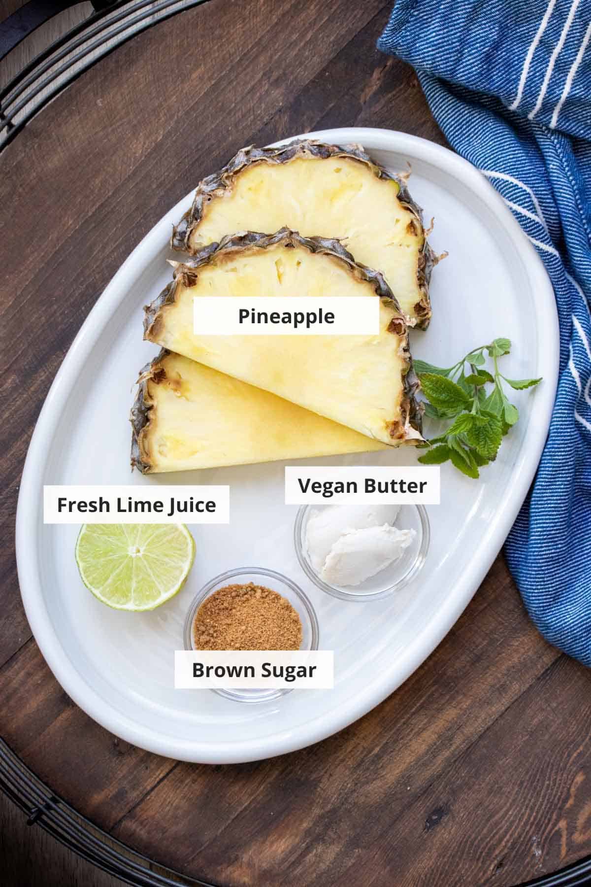 Ingredients for grilled pineapple with brown sugar on a white plate.