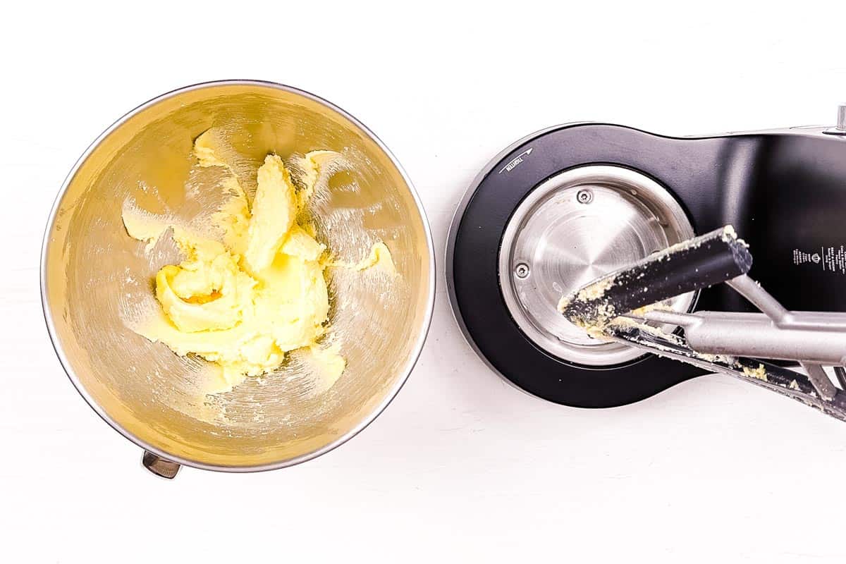 Butter and sugar creamed in the bowl of a stand mixer.