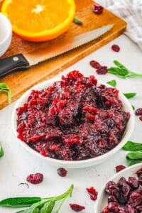 Rich and delicious cranberry sauce made with dried cranberries in a small white dish.