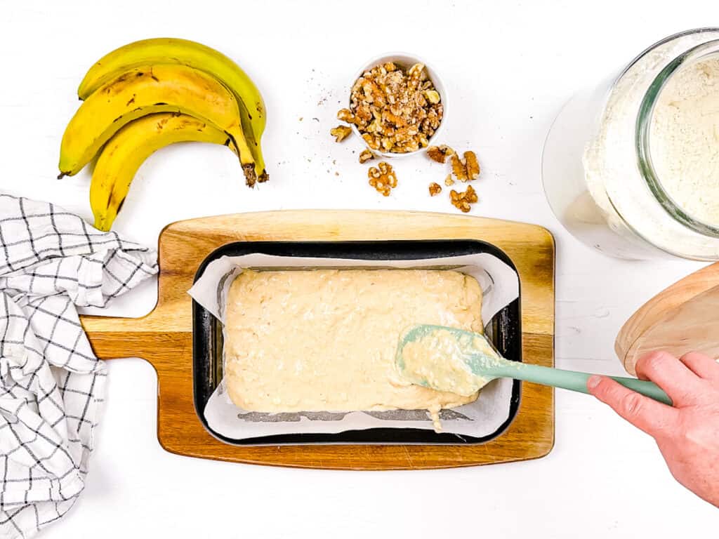 Batter added to a loaf pan before being put in the oven.