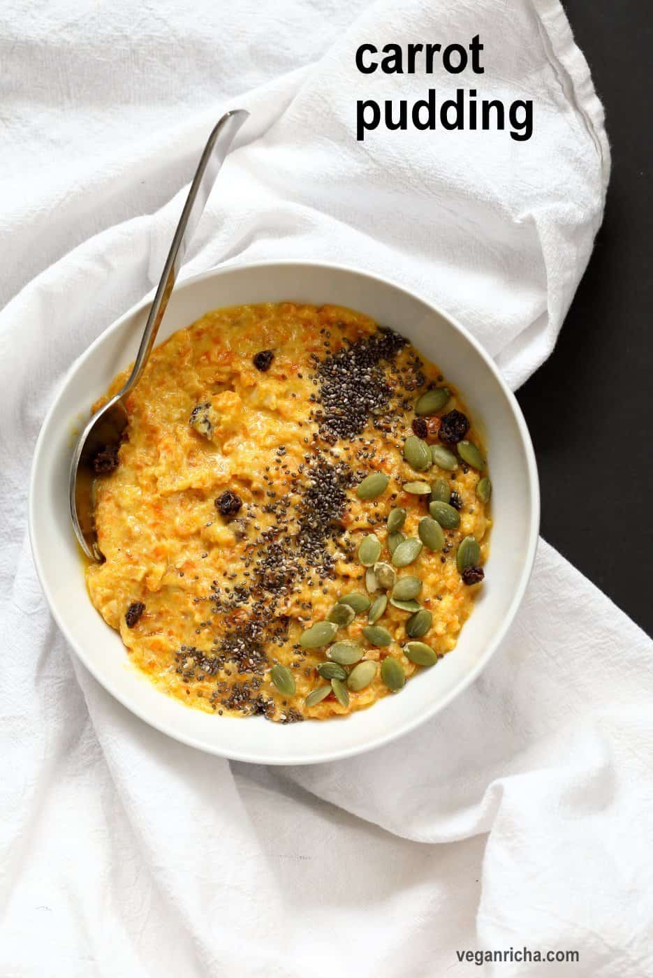 Carrot Pudding with Cardamom - Carrot Kheer Recipe. Shredded Carrots slow cooked with almond milk, roasted nuts and cardamom. Serve as is or top with toasted nuts, seeds and chia. Vegan Gluten-free Soy-free Nut-free option | VeganRicha.com