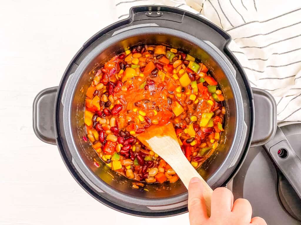 Ingredients for meatless Instant Pot chili stirred in the Instant Pot.
