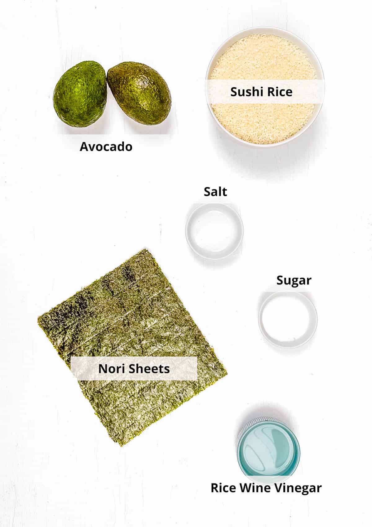 Ingredients for vegan avocado sushi rolls recipe on a white background.