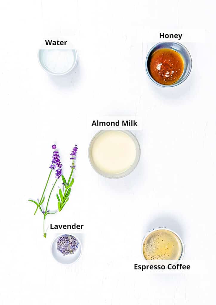 Ingredients for honey lavender latte recipe on a white background.