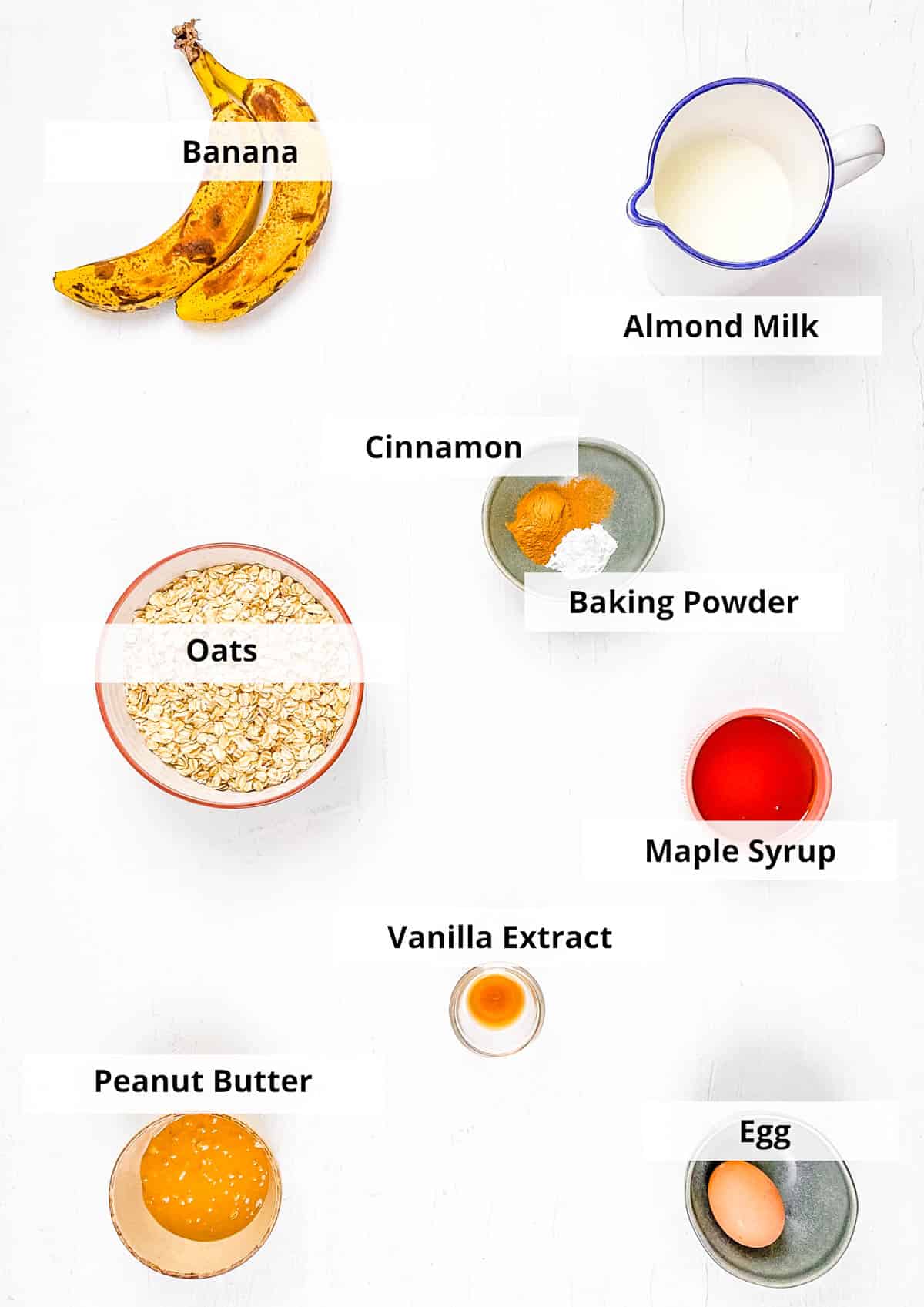 Ingredients for peanut butter banana baked oatmeal recipe on a white background.