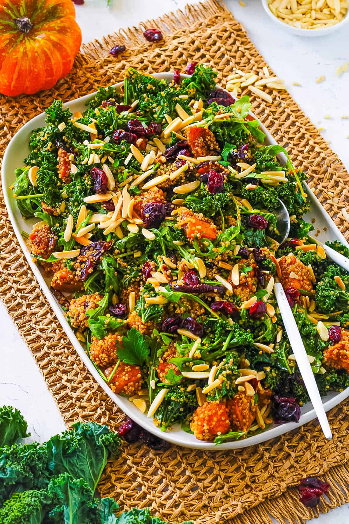 Roasted pumpkin salad on a white serving platter.