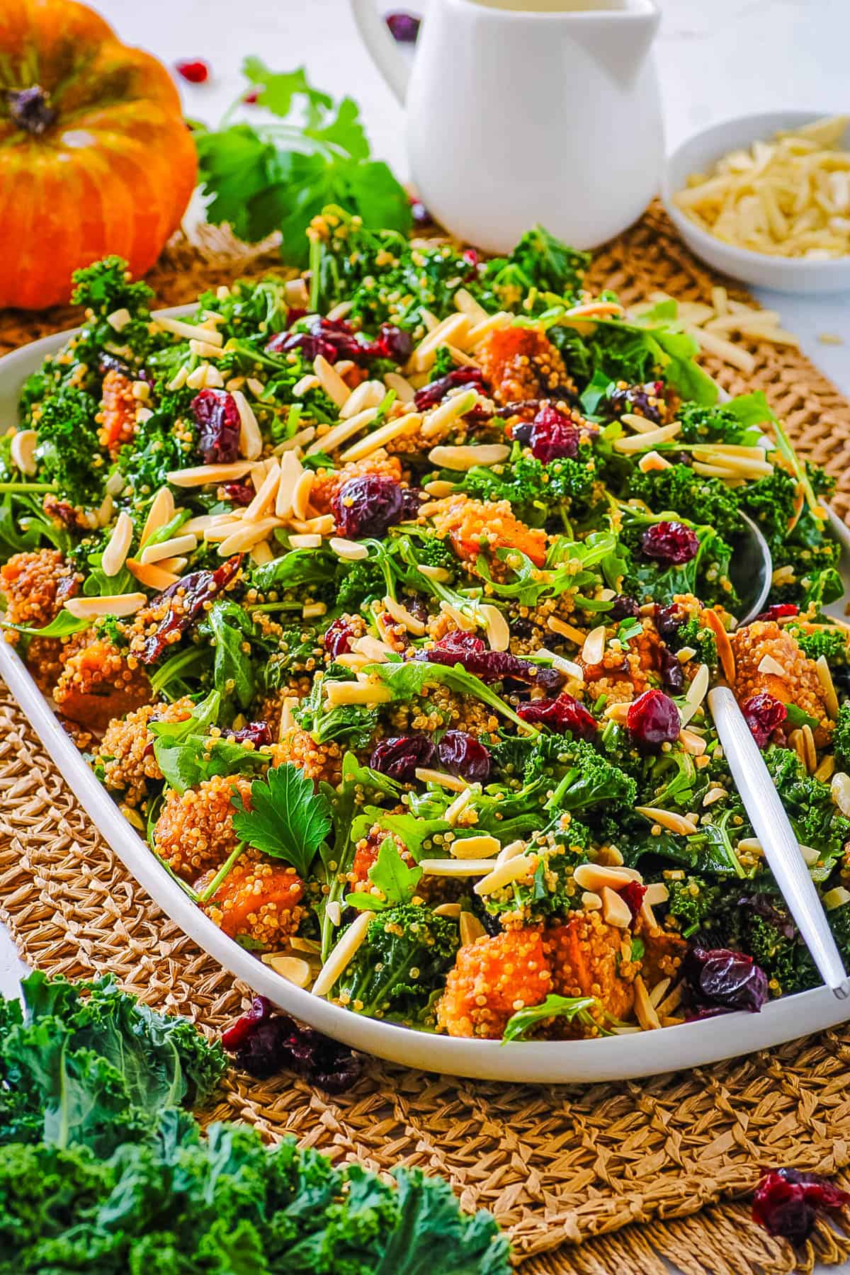 Roasted pumpkin quinoa salad on a white serving platter.