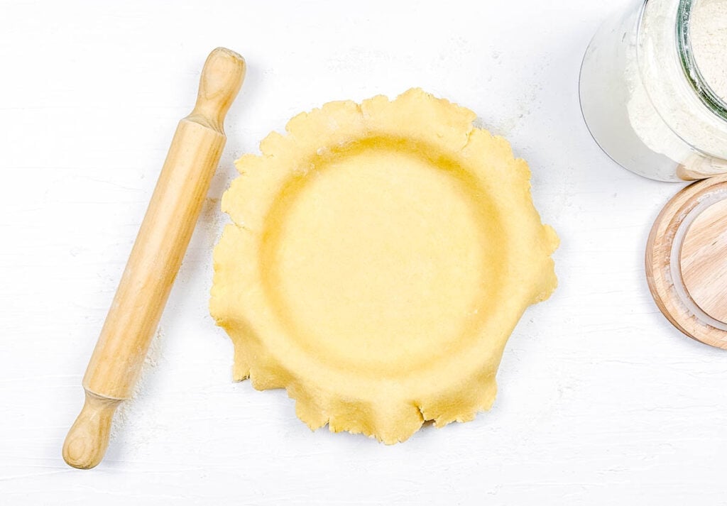 Pie crust added to baking dish.