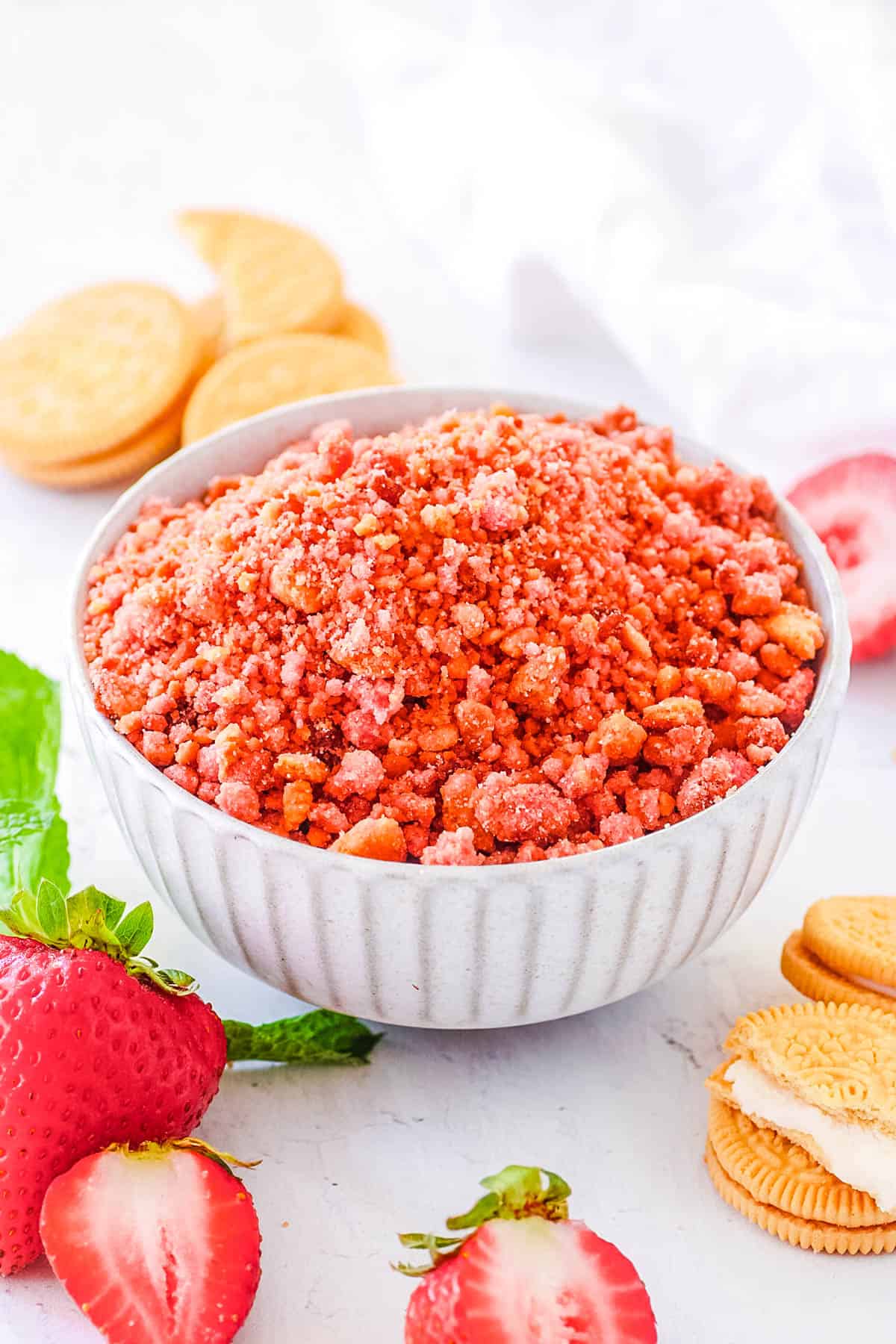 Easy strawberry crunch topping served in a white bowl.