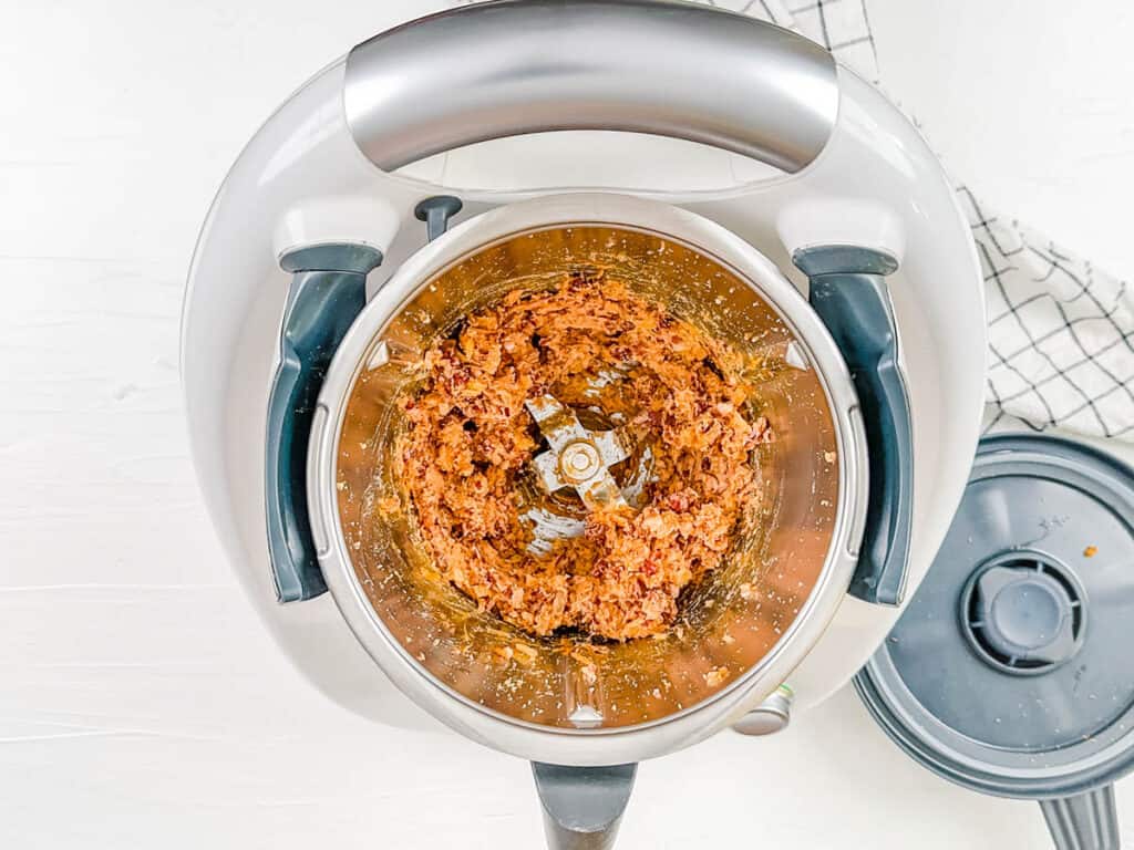 Mashed bean mixture filling for taquitos in a food processor.