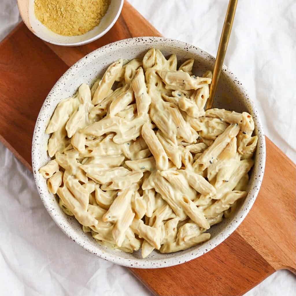 Silken tofu mac and cheese in a white bowl.