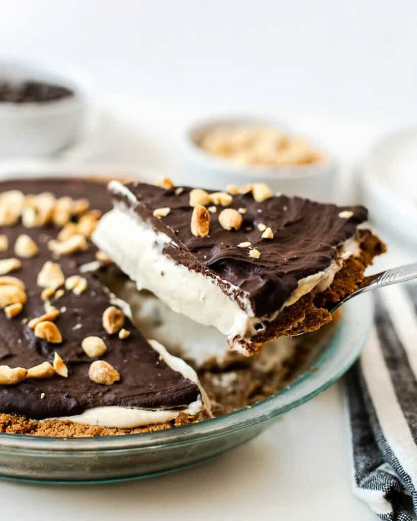 Frozen peanut butter cup pie in a glass pie plate.