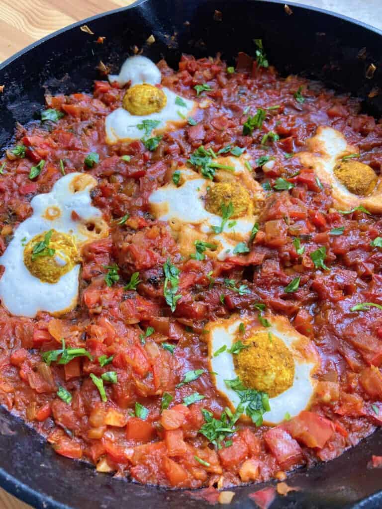 Vegan shakshuka in a black skillet.