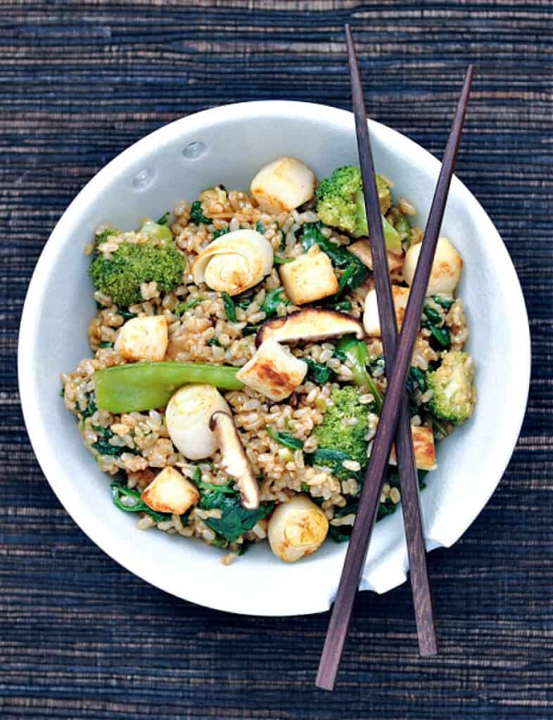 Sesame scallop fried rice in a white bowl with silken tofu.