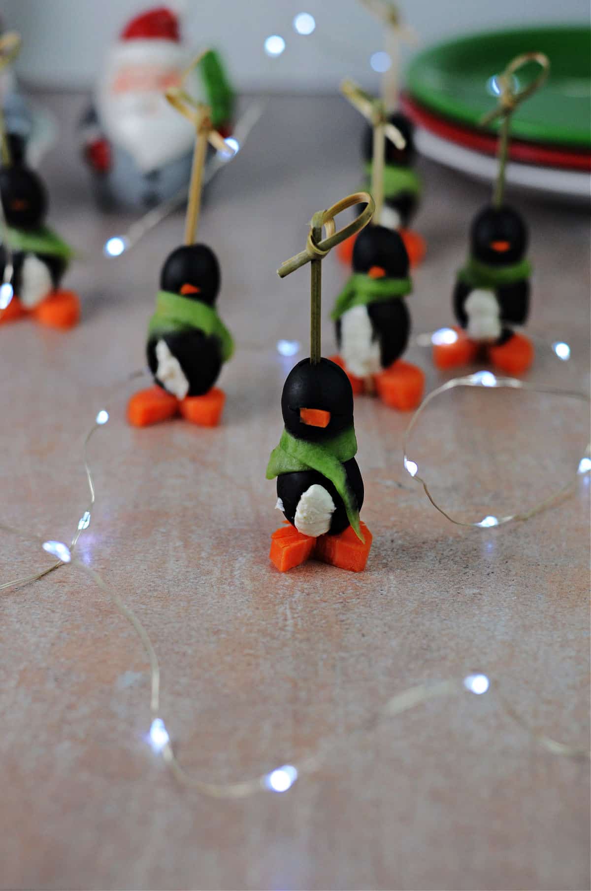 Christmas penguin cream cheese appetizer on a countertop.