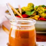 Low calorie stir fry sauce, served in a glass jar with a spoon.