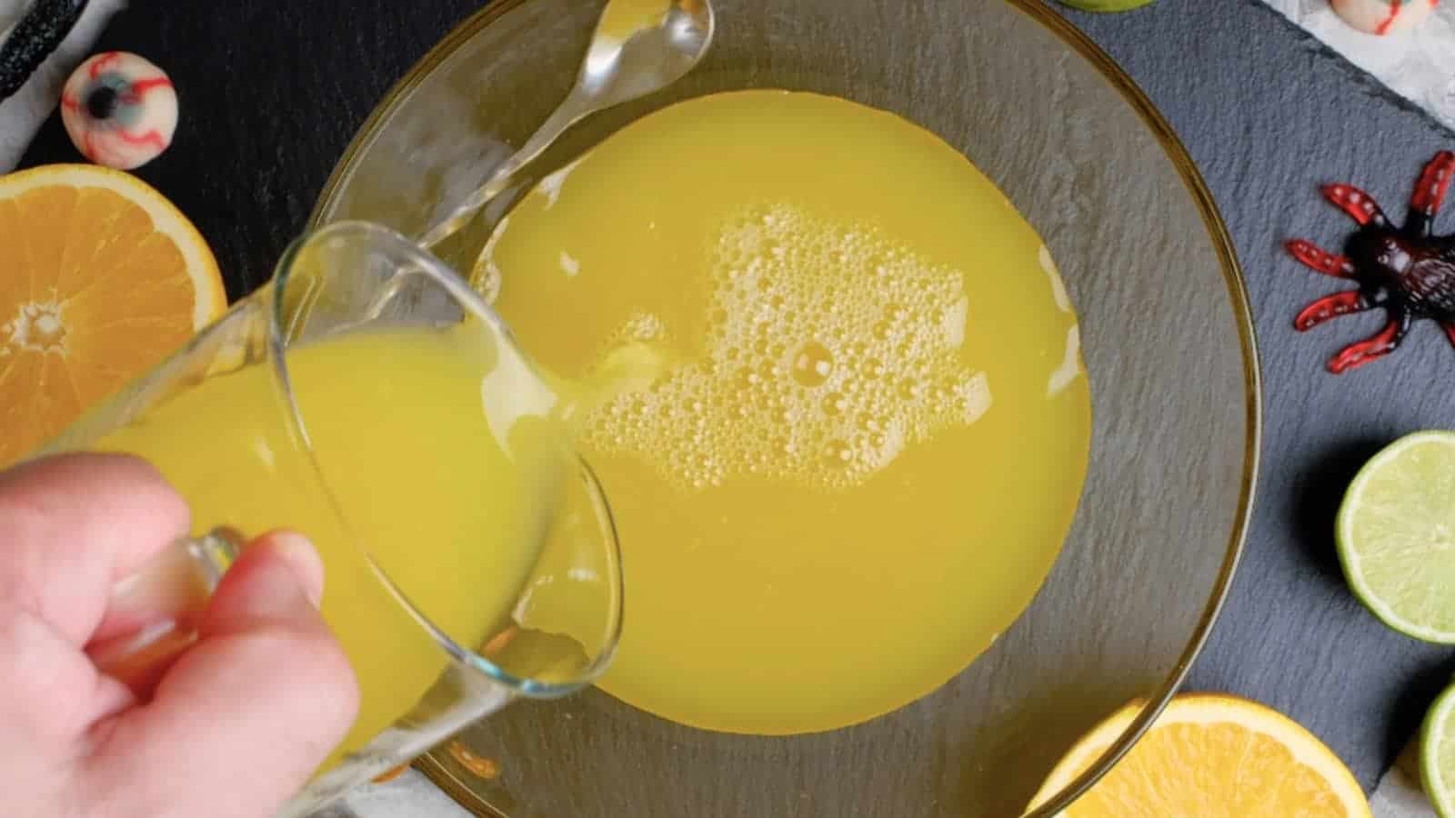 Combining pineapple juice and orange juice.
