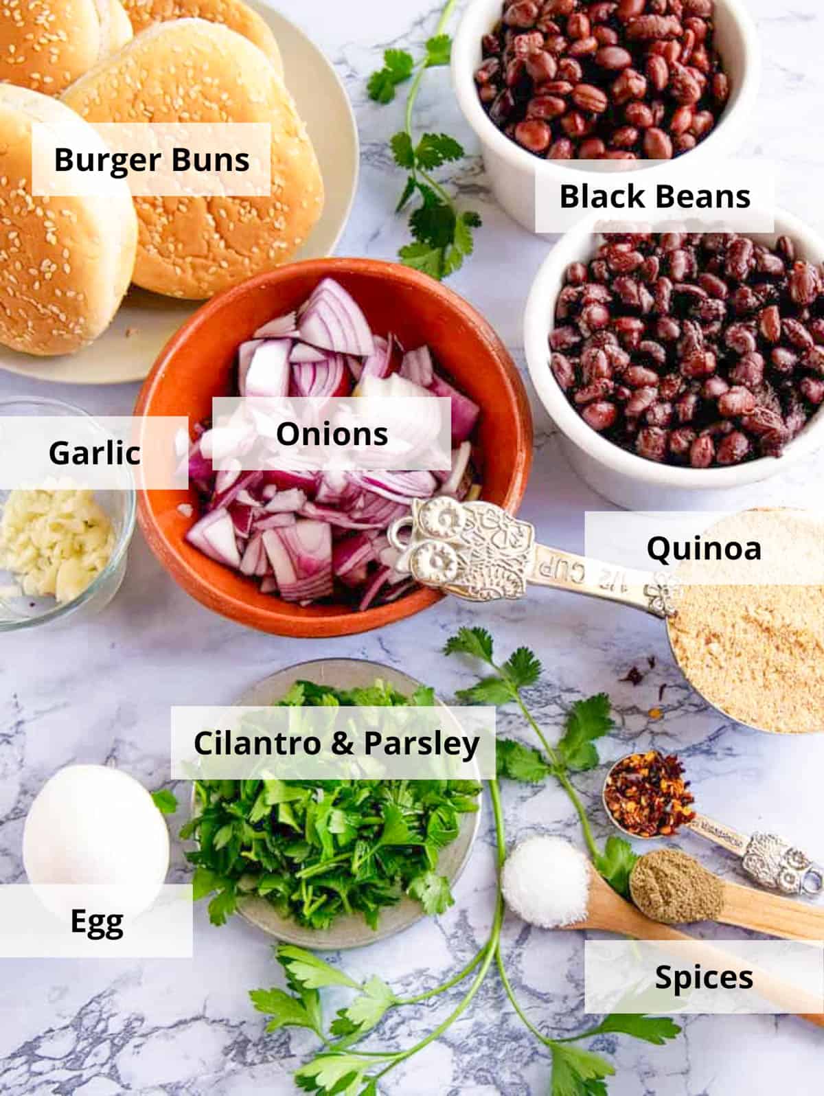 Ingredients for black bean quinoa burger recipe on a white background.