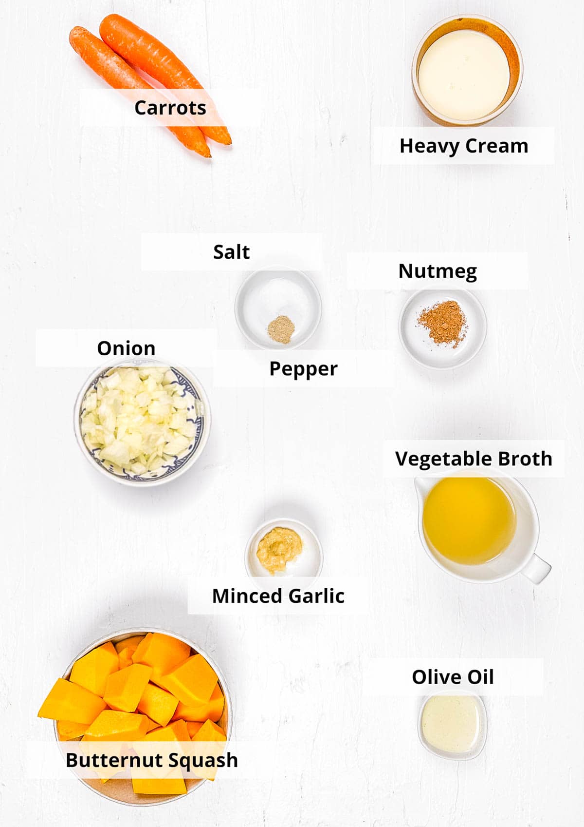Ingredients for easy butternut squash bisque recipe on a white background.