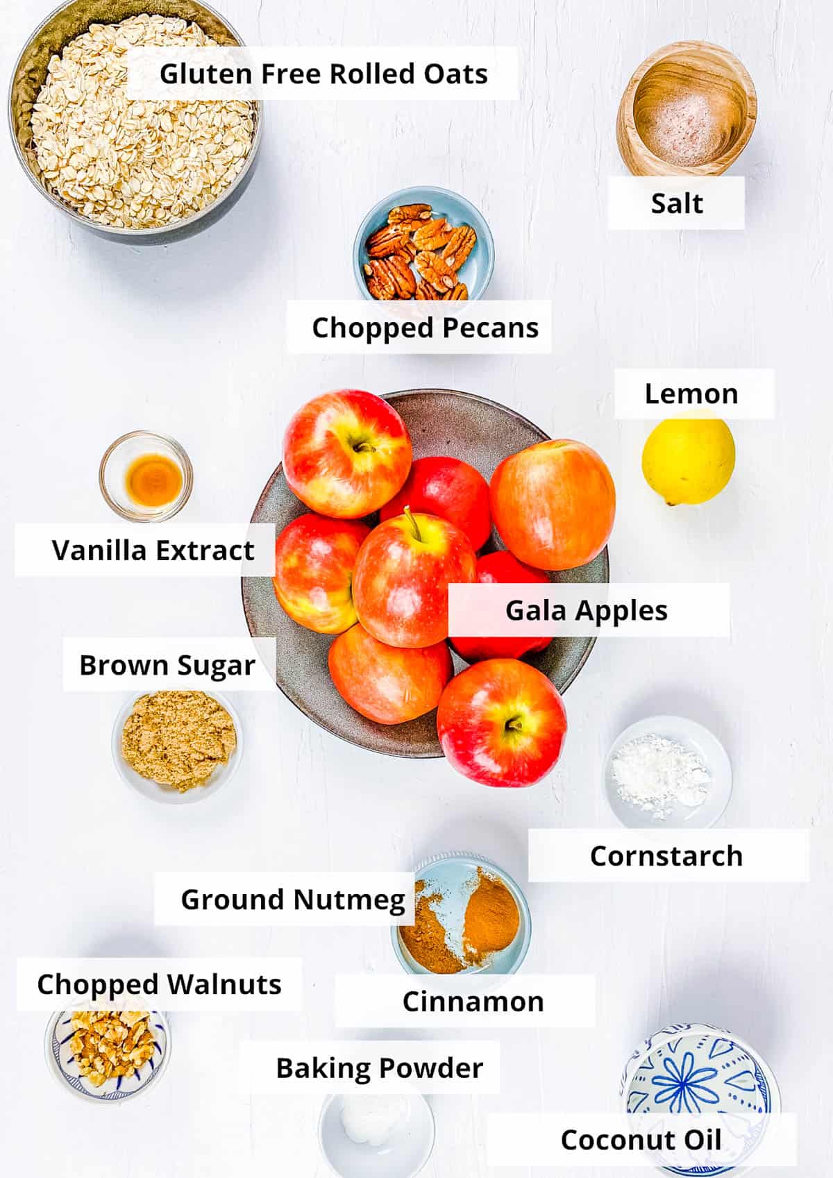Ingredients for vegan apple crisp recipe on a white background.